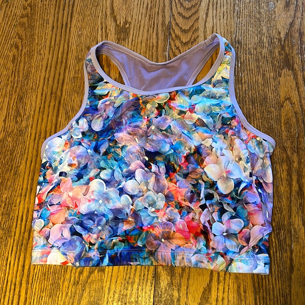 Meshed up crop sports bra and swim top with removable pads.